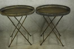 A pair of gilt metal folding tables. H.73 W.63cm.