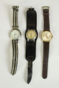 Three vintage men's watches, including a B.Jobin automatic watch, a Movado automatic watch and a