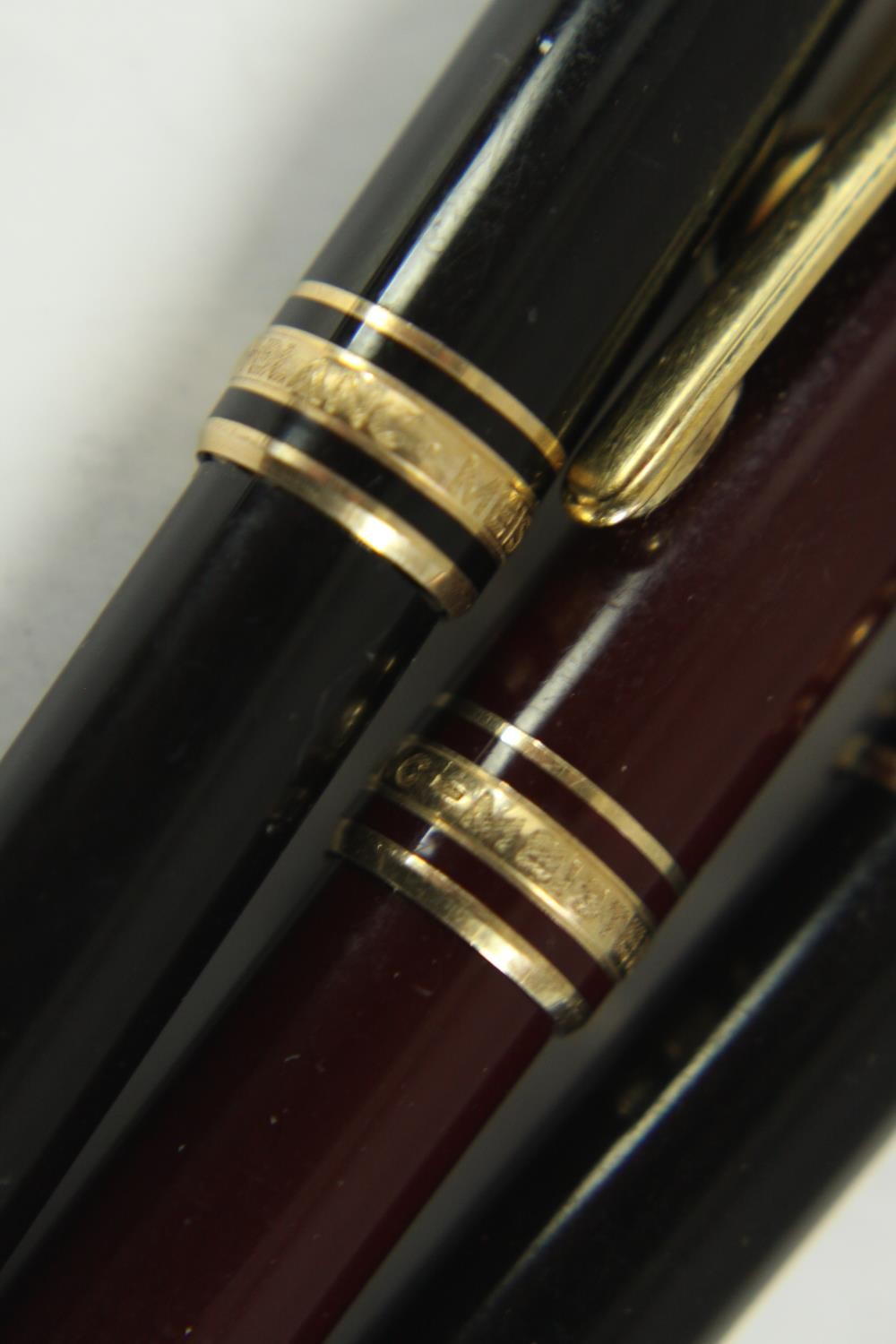 Three Mont Blanc Meisterstuck black lacquer ballpoint pens with gold plated detailing along with a - Image 6 of 7