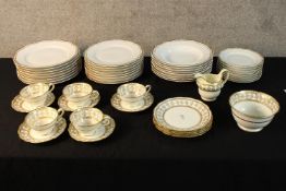 An A. Raynaud & Co Limoges 'Polka' gilded design eight person dinner set along with a five person