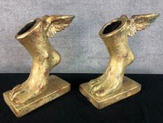 Two gilded fibreglass winged feet on rectangular bases. H.40 W.30cm. (each)