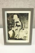 A framed photograph of Betty Davis. Appears to be signed. H.27 x W.20 cm.