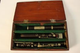 A hardwood cased 19th century cocuswood and nickel flute, Nach Meyer. H.16 W.30cm.