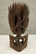 An intricate and highly detailed carving of a winged figure - a birdman. H.30 cm.