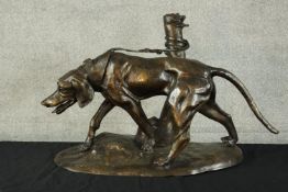 After R J Mene, a large spelter figure group of a hunting dog tied to a post. Signed to base. H.43