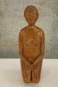 A carving of a kneeling nude. Well finished but without a visible signature. H.23 cm.