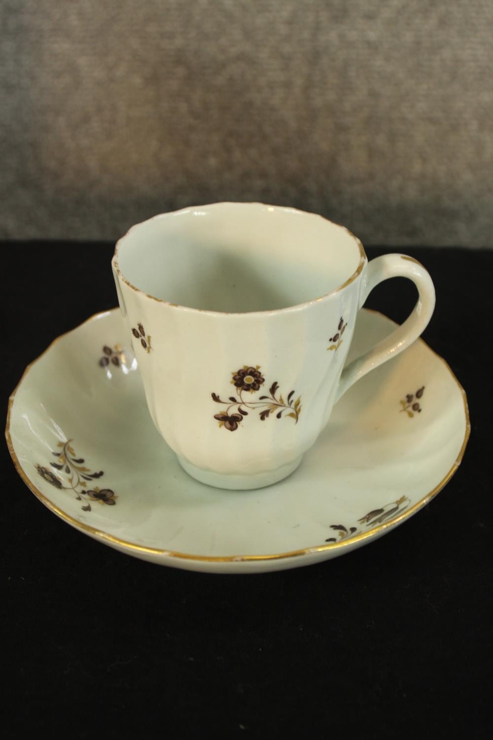 A 19th century hand painted tea set made up of three cups and saucers, a sugar bowl and two - Image 2 of 4