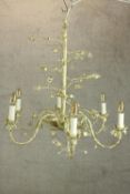 A pair of vintage six branch painted chandeliers with scrolling naturalistic arms. H.70 Dia.70cm.