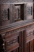 Court cupboard, 17th century Jacobean oak, in two sections, well carved all over. H.159. W.150cm.