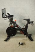 A Peloton exercise bike with screen. H.130 W.120cm.