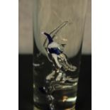 A Studer Williams hand blown jester bottle with spirit along with a set of six blown glass Etter