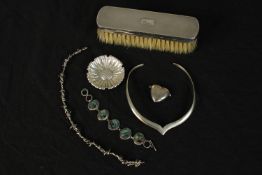 A collection of silver and jewellery, including a modern silver collar, a relief daisy design dish