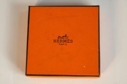 A boxed Hermes gold plated Chaine d'Ancre scarf ring, stamped Hermes. L.7.5 W.7.5cm. (box)