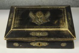 An ebonised and brass box filled with a collection of jewellery including an agate bangle and jade