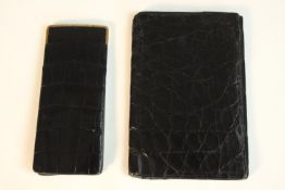 Two early 20th century black patent alligator skin wallets, one a glasses case with 9ct gold