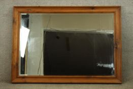 Large wall mirror, pine framed with bevelled plate. H.100 W.140cm.