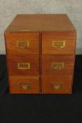 A mid century teak table top filing cabinet. H.36 W.36cm.