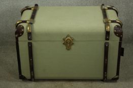 A vintage style travelling trunk with leather and wood bindings. H.48 W.78cm.