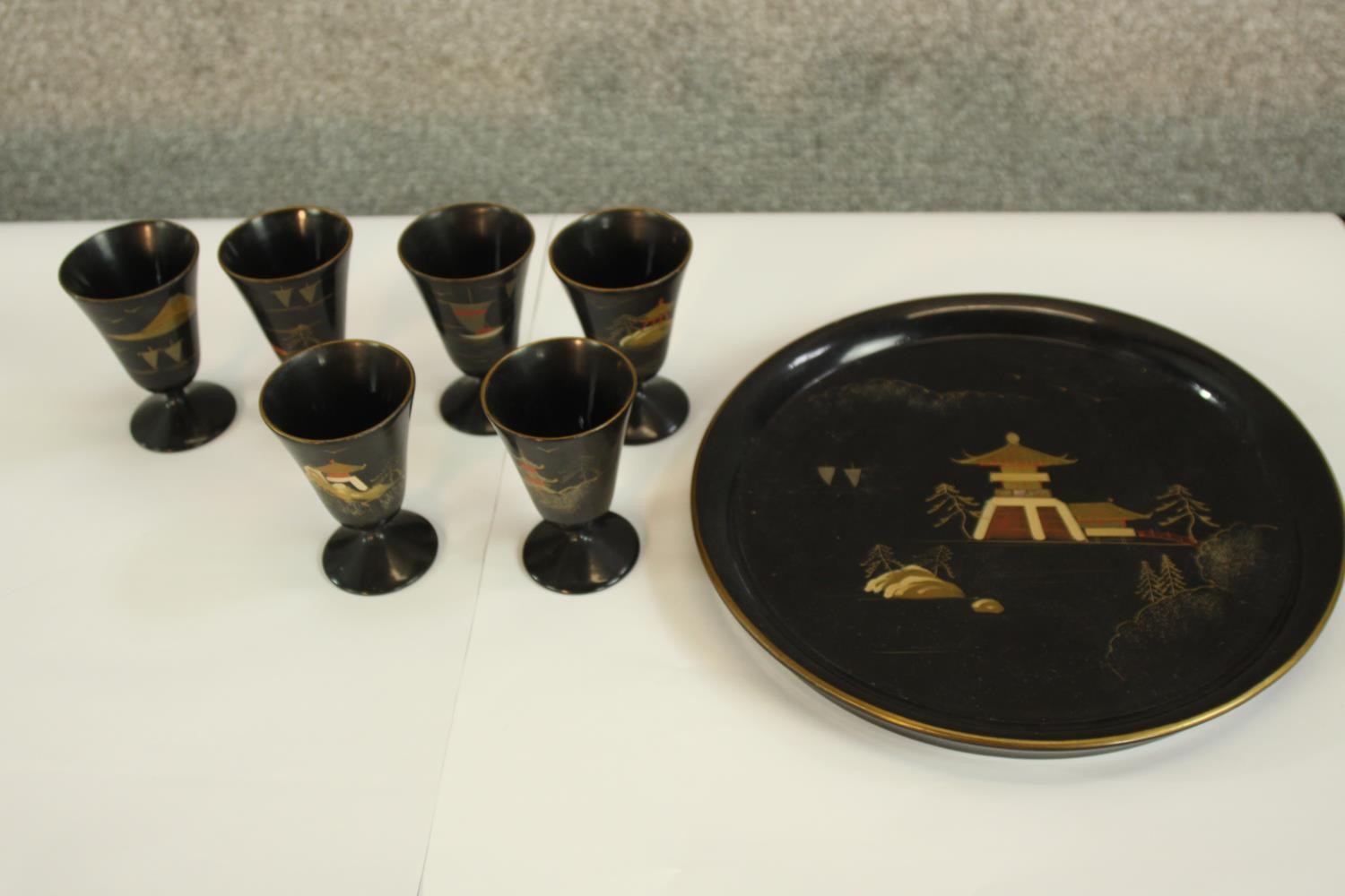 A Japanese lacquered set of six cups, a tray, five small plates housed in a round box. Each item - Image 3 of 5