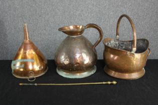 A copper jug, funnel and coal bucket with brass poker. The funnel with evidence of past repairs. The