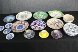 A collection of porcelain plates and cups. A varied mix of ages and styles. Includes a bulb bowl.