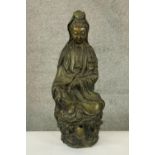 A large Chinese brass figure of Guanyin the Goddess associated with compassion. Probably early