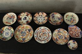 A mixed collection of decorative Chinese plates. Hand painted and with the artists seals on the