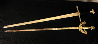 Two decorative Toledo made swords. With engraved decoration on the blade, pommel and cross guard.