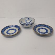 A pair of early 20th century Chinese blue and white floral design saucers with red character mark to