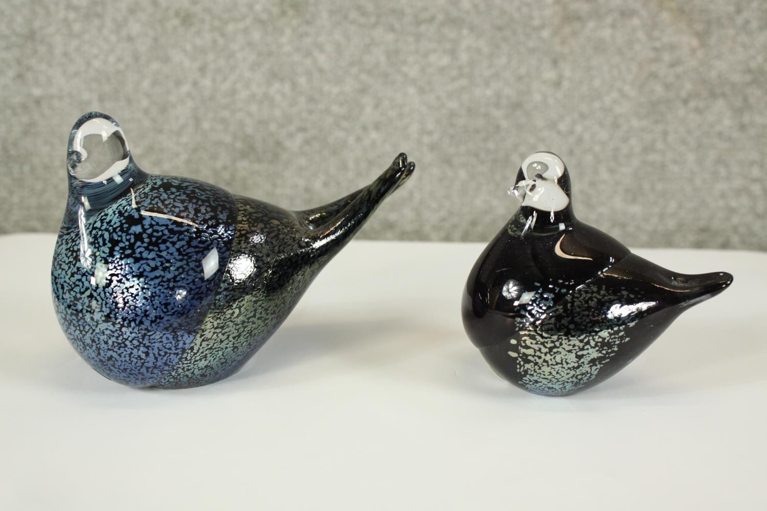 Two blue coloured glass birds. The largest of the pairs is H.10 cm.
