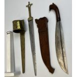 Two decorative Malayan swords with their scabbards. One with engraved decoration on the blade and