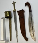 Two decorative Malayan swords with their scabbards. One with engraved decoration on the blade and