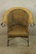 Conservatory armchair, wicker with an iron frame.