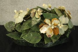 A mid century vintage Chinese carved hardstone and jade flower arrangement raised on a marble
