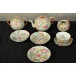 A collection of decorative ceramics to include a teapot, jug, cup and saucer, pot, and three plates.