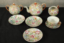 A collection of decorative ceramics to include a teapot, jug, cup and saucer, pot, and three plates.