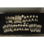A large collection of silver plated cutlery to include spoons, and knifes and forks decorated with