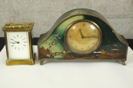 A mantel and carriage clock. The carriage clock with glass sides and exposed working. The mantle