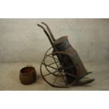 A rare iron milk cart or churn set on a wheeled trolley. Probably late Victorian but could be