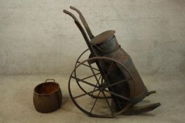 A rare iron milk cart or churn set on a wheeled trolley. Probably late Victorian but could be