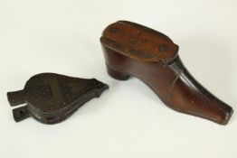 Two wooden snuff boxes, one in the shape of bellows and the other a boot. The largest of the pair