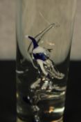 A Studer Williams hand blown jester bottle with spirit along with a set of six blown glass Etter