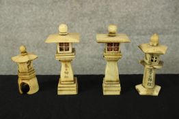 Four carved bone towers. With Chinese text and images of animals. The largest of the four measures