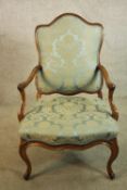Fauteuil, Louis XV style walnut framed, upholstered in damask.