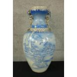 A large blue hand painted vase decorated with Chinese pagoda and gilt edging. H.50cm.