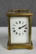 Brass carriage skeleton clock. Probably early twentieth century. H.14 cm.