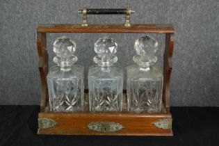 Tantalus, 19th century oak and brass with cut crystal decanters. H.33 W.35cm.