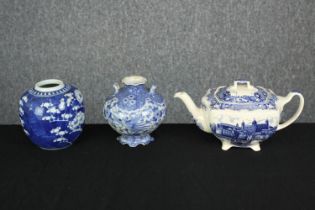 A tea pot and two pots. The ironstone teapot is decorated with views of 'Old London' and made by