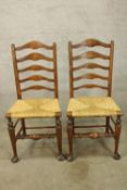 A pair of 19th century beech Lancashire ladder back dining chairs.