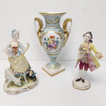 Two hand painted porcelain figures, one of a lady and one of a dandy gentleman along with a twin